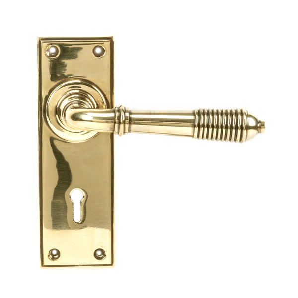 From The Anvil's Aged Brass Reeded Lever Lock Set