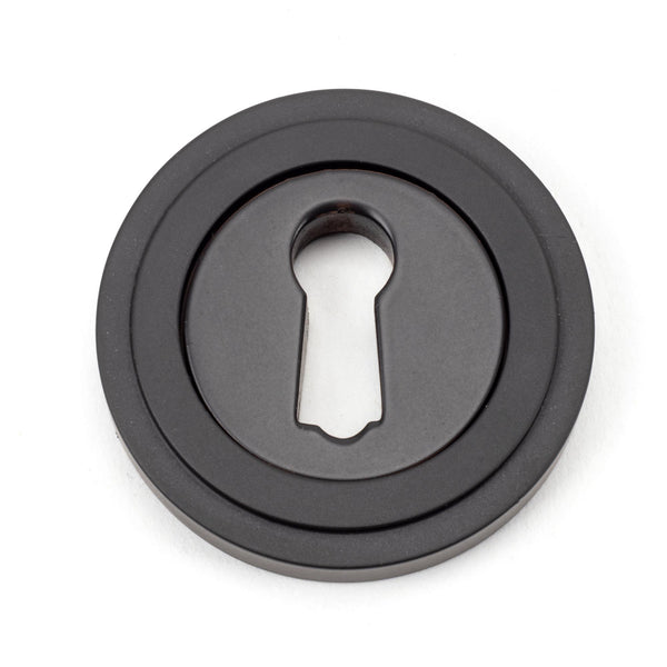 From The Anvil's Aged Bronze Round Escutcheon