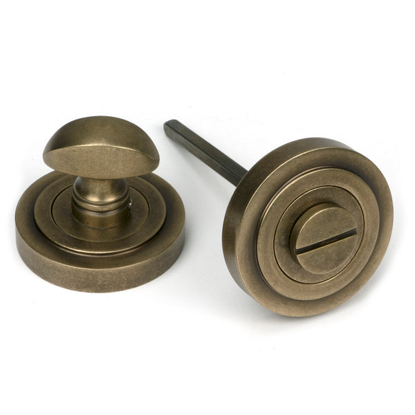 From The Anvil's Burnished Brass Concealed Round Thumbturn Set