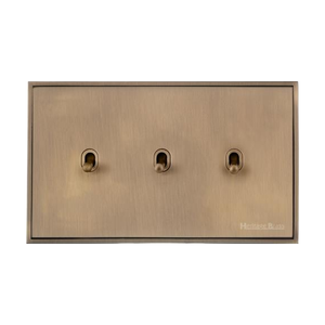 Executive Range Antique Brass Switches & Sockets, EX91 - 3 Gang Stockholm Toggle by Heritage Brass By M-Marcus