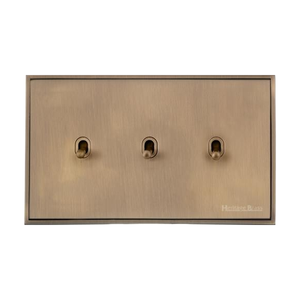 Executive Range Antique Brass Switches & Sockets, EX91 - 3 Gang Stockholm Toggle by Heritage Brass By M-Marcus