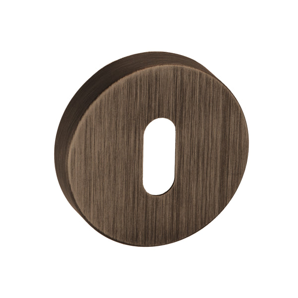 Forme Key Escutcheons on Minimal Round Rose by Atlantic Hardware