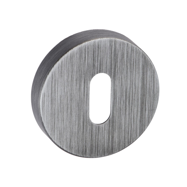 Forme Key Escutcheons on Minimal Round Rose by Atlantic Hardware