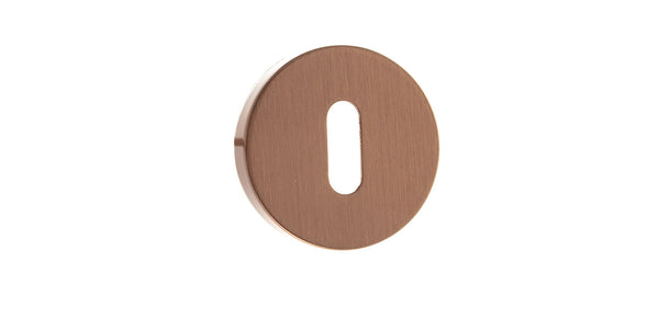 Forme Key Escutcheons on Minimal Round Rose by Atlantic Hardware