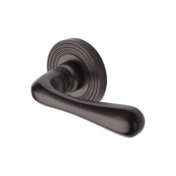 Charlbury Reeded Door Handle on Round Rose by M Marcus - Heritage Brass