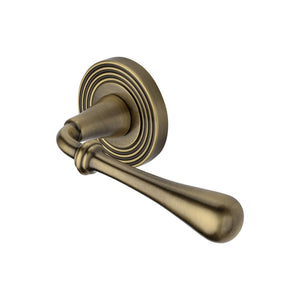 Roma Reeded Door Handle on Round Rose by M Marcus - Heritage Brass