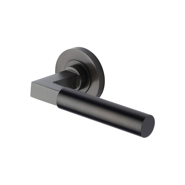 Spectral Door Handle on Round Rose by M Marcus - Heritage Brass