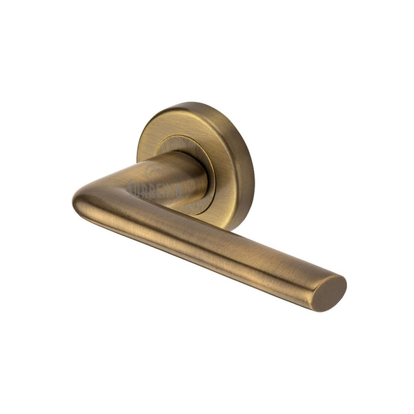 Lena Door Handle on Round Rose by M Marcus - Heritage Brass