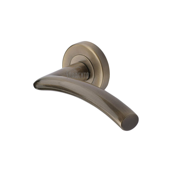 Tosca Door Handle on Round Rose by M Marcus - Heritage Brass