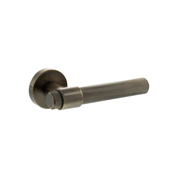 Senza Pari Fasana Linear Knurled Lever Door Handle on Minimal Round Rose by Atlantic Hardware