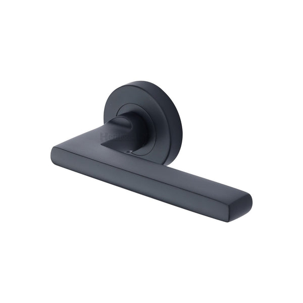 Trident Door Handle on Round Rose by M Marcus - Heritage Brass