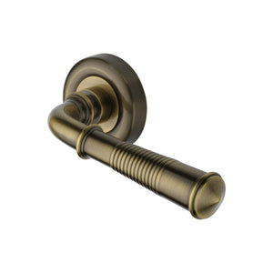 Colonial Reeded Door Handle on Round Rose by M Marcus - Heritage Brass