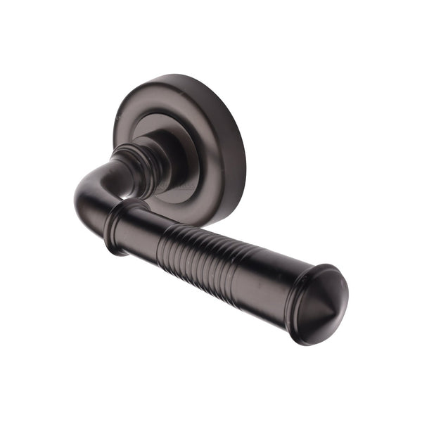 Colonial Reeded Door Handle on Round Rose by M Marcus - Heritage Brass
