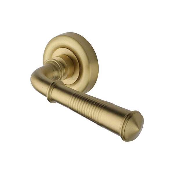 Colonial Reeded Door Handle on Round Rose by M Marcus - Heritage Brass
