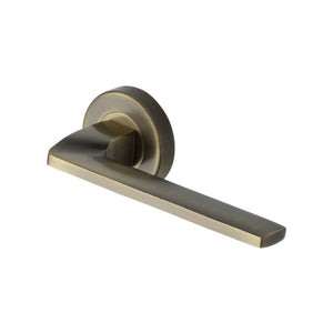 Metro Angled Door Handle on Round Rose by M Marcus - Heritage Brass