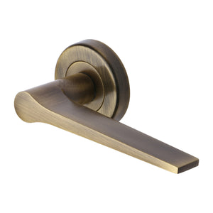 Gio Door Handle on Round Rose - Antique Brass