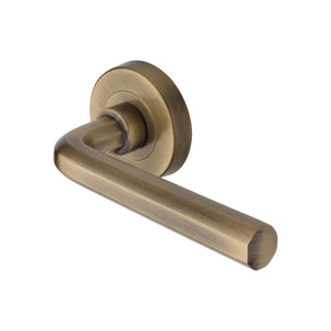 Octave Door Handle on Round Rose by M Marcus - Heritage Brass