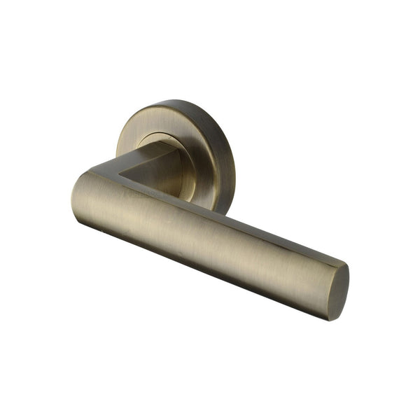 Poseidon Door Handle on Round Rose by M Marcus - Heritage Brass