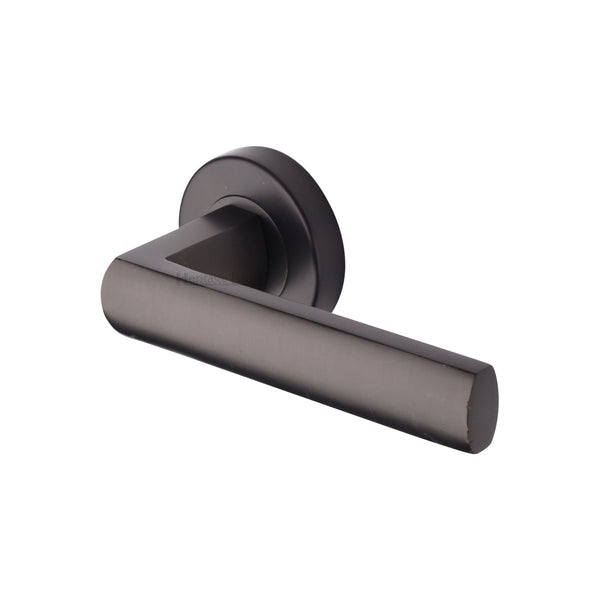 Poseidon Door Handle on Round Rose by M Marcus - Heritage Brass