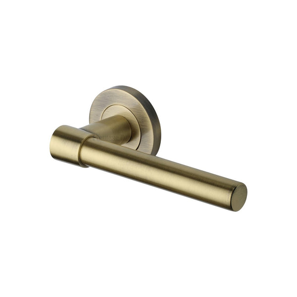 Phoenix Door Handle on Round Rose - Antique Brass