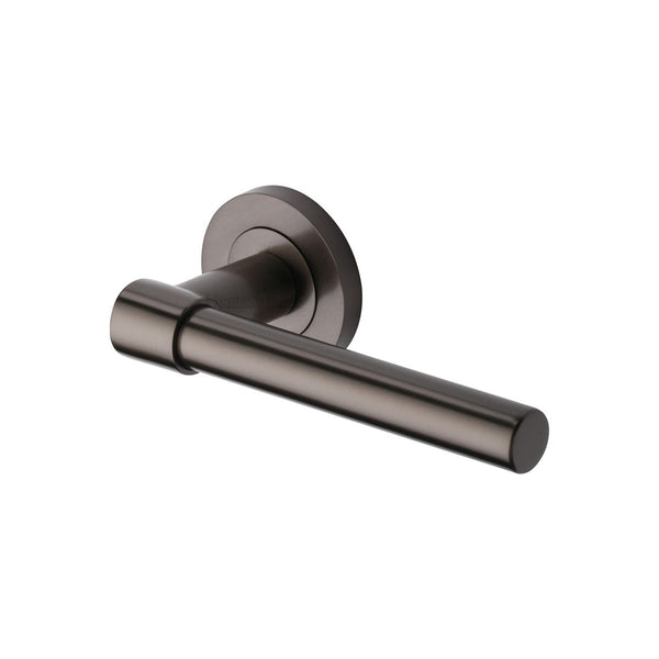 Phoenix Door Handle on Round Rose by M Marcus - Heritage Brass