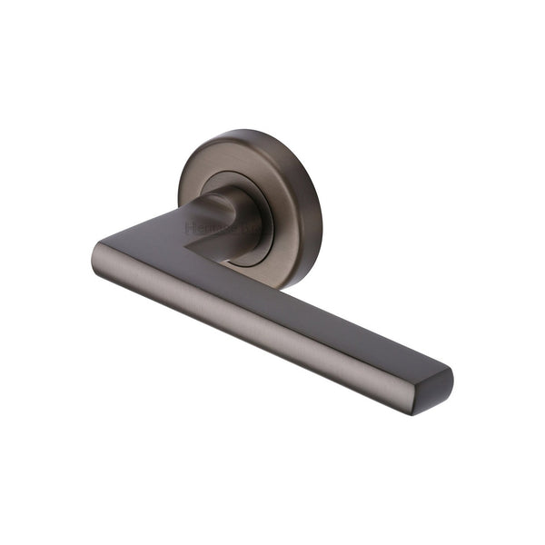 Trident Door Handle on Round Rose by M Marcus - Heritage Brass