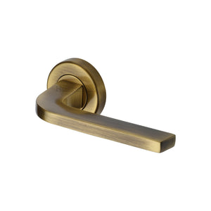 Bellagio Door Handle on Round Rose by M Marcus - Heritage Brass