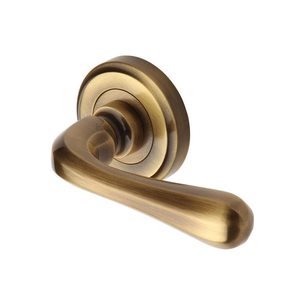 Charlbury Door Handle on Round Rose by M Marcus - Heritage Brass