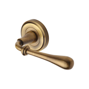 Roma Door Handle on Round Rose by M Marcus - Heritage Brass